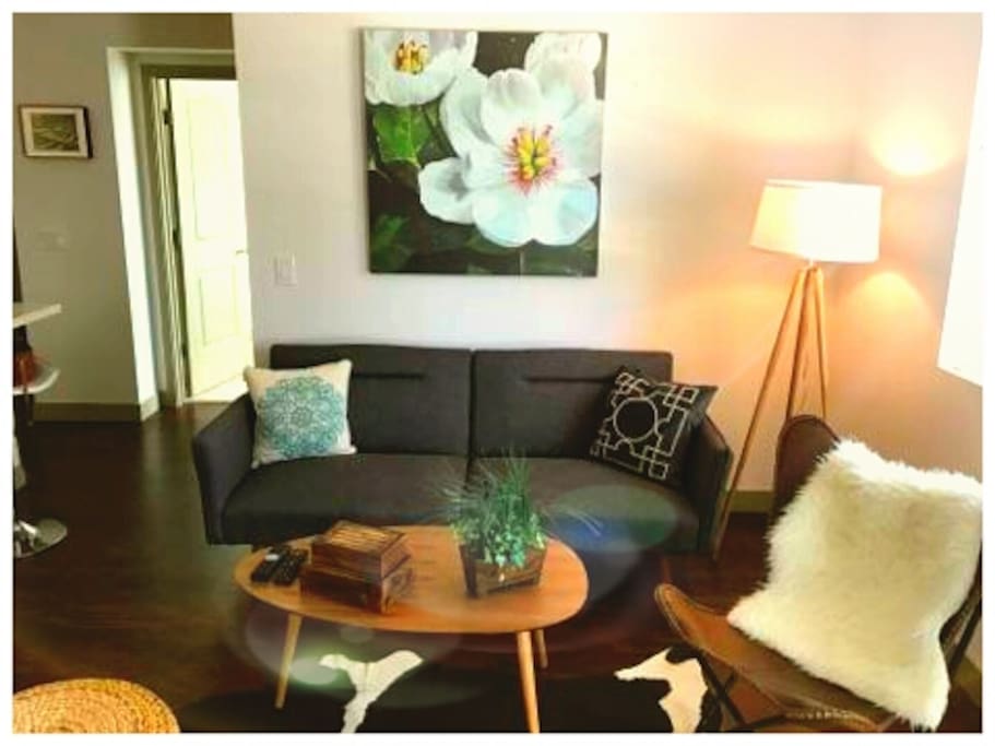 Living room with Smart TV, High Speed WiFi Internet, and full list of channels.