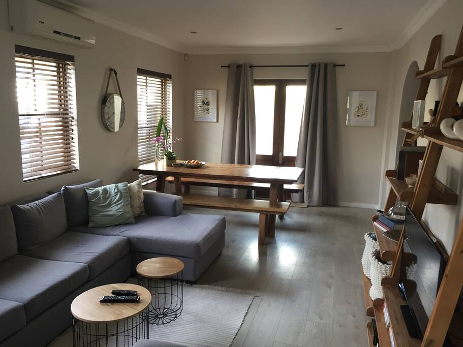 Lounge and dining area leading to outside entertainment area