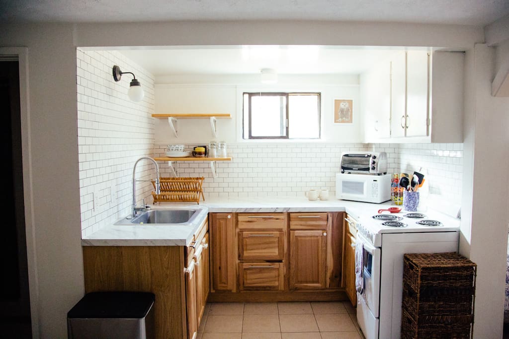 Freshly remodeled kitchen space with all the necessary appliances and utensils.