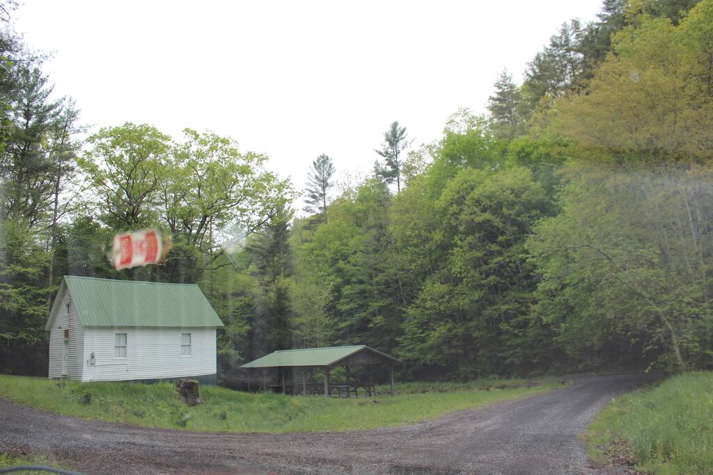 One room church at base of driveway. Driveway is mid-image right edge of photo