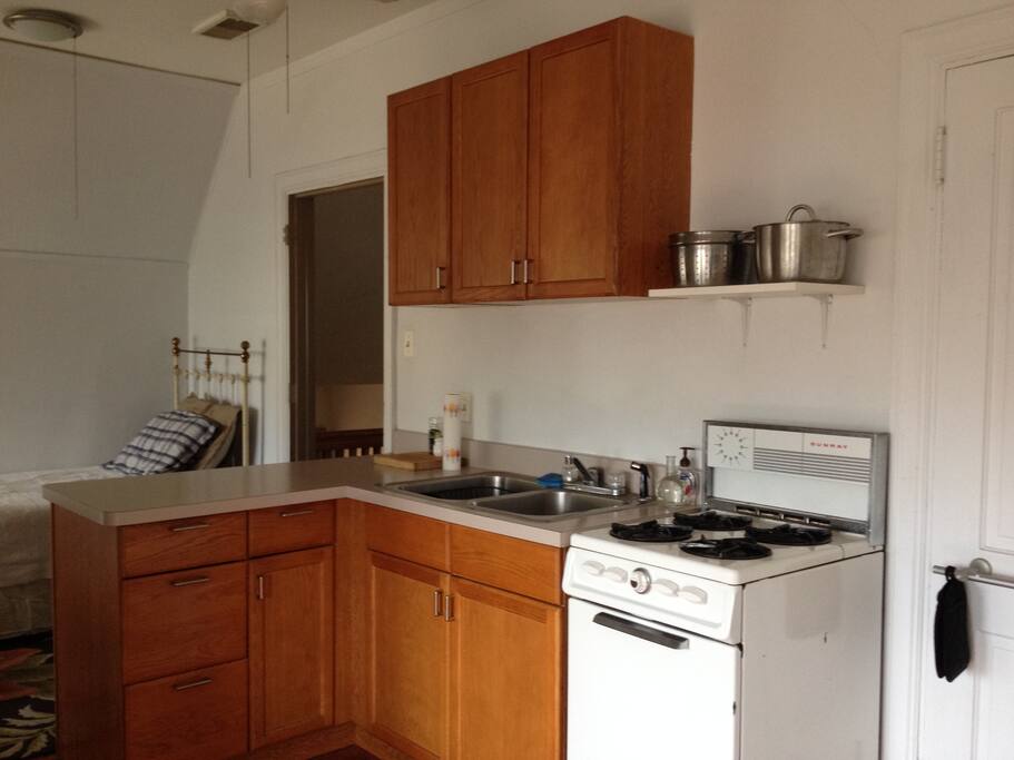 Fully functional kitchen. 1900s iron and brass french bed for extra guests.