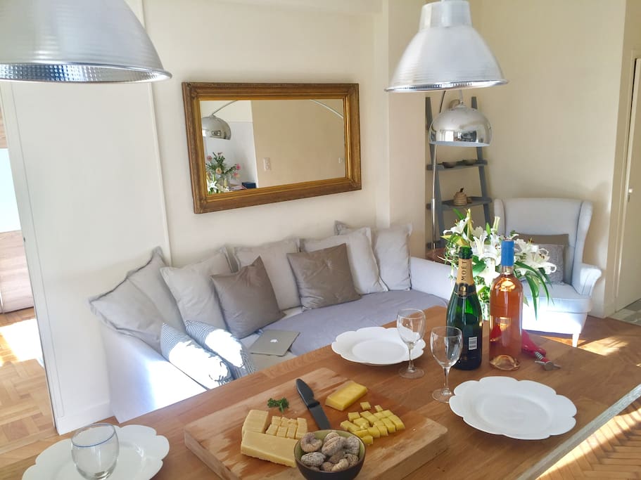 General view of the living space with dressed table on the wooden bar