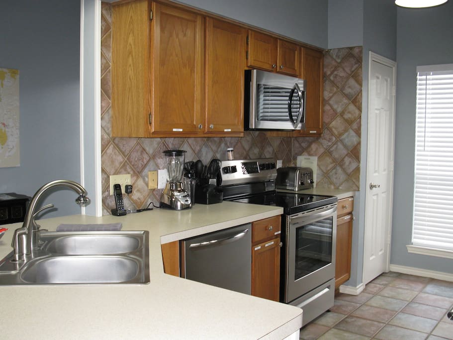 Fully equipped kitchen with stainless appliances