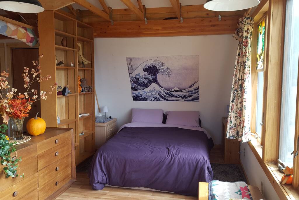 A very comfortable queen-size bed with soft sheets and restful pillows.