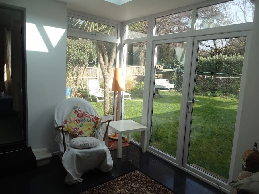 In summer time, this room makes a lovely dining area with views over the secluded garden.