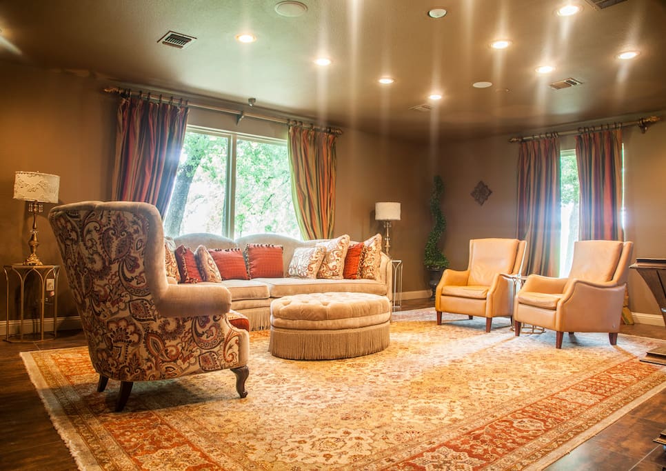 Large living area with fireplace & TV