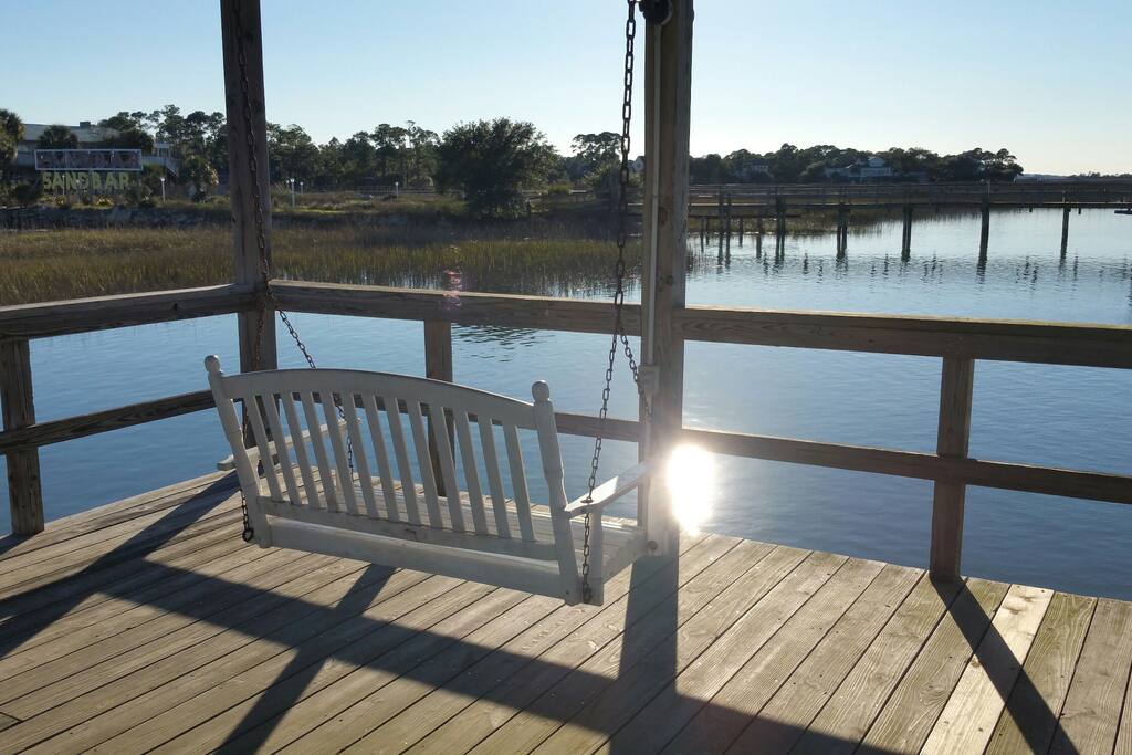 Porch swing under community doxk pavillion