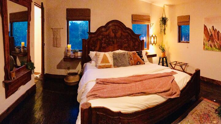 Master bedroom with a grand king size bed