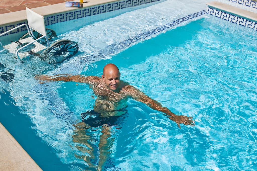 Ramped swimming pool and chair provided