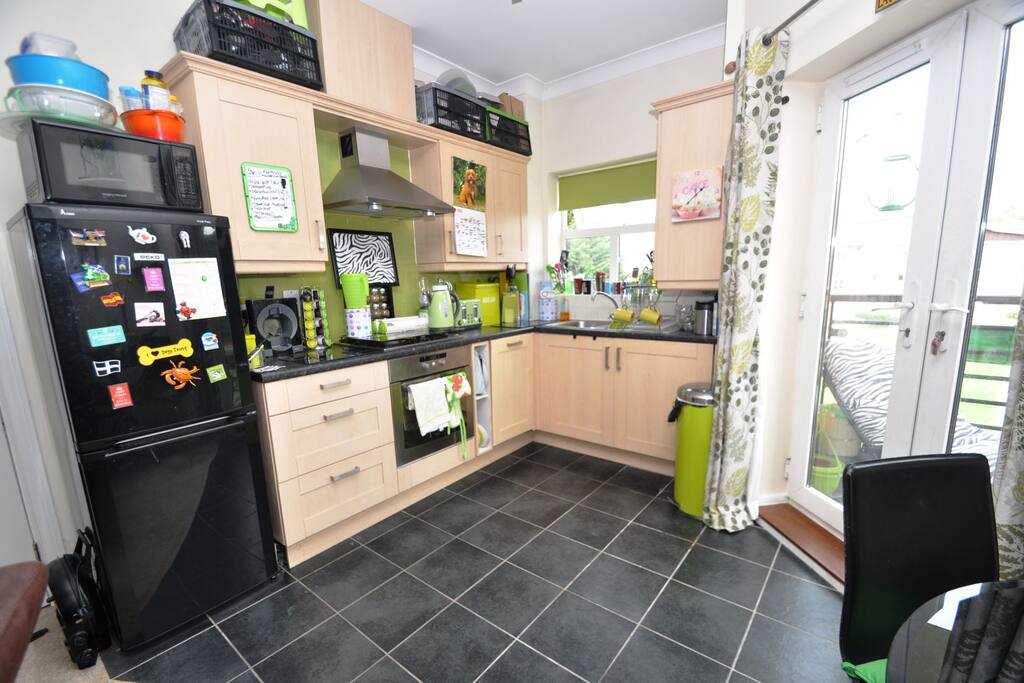 Kitchen area with balcony off to the right.
