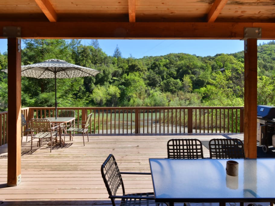 Large patio deck perfect for grilling and looking out at the lush river scenery