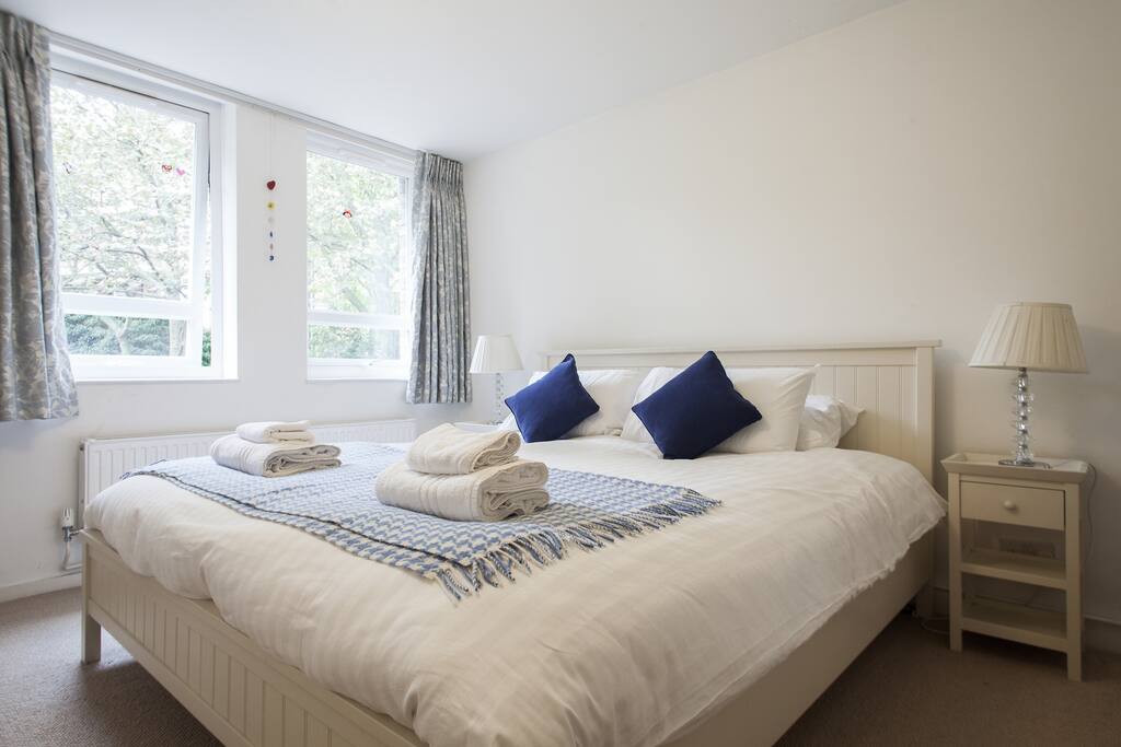 BEDROOM 1: Calm master bedroom with comfy super king sized bed and en-suite bathroom