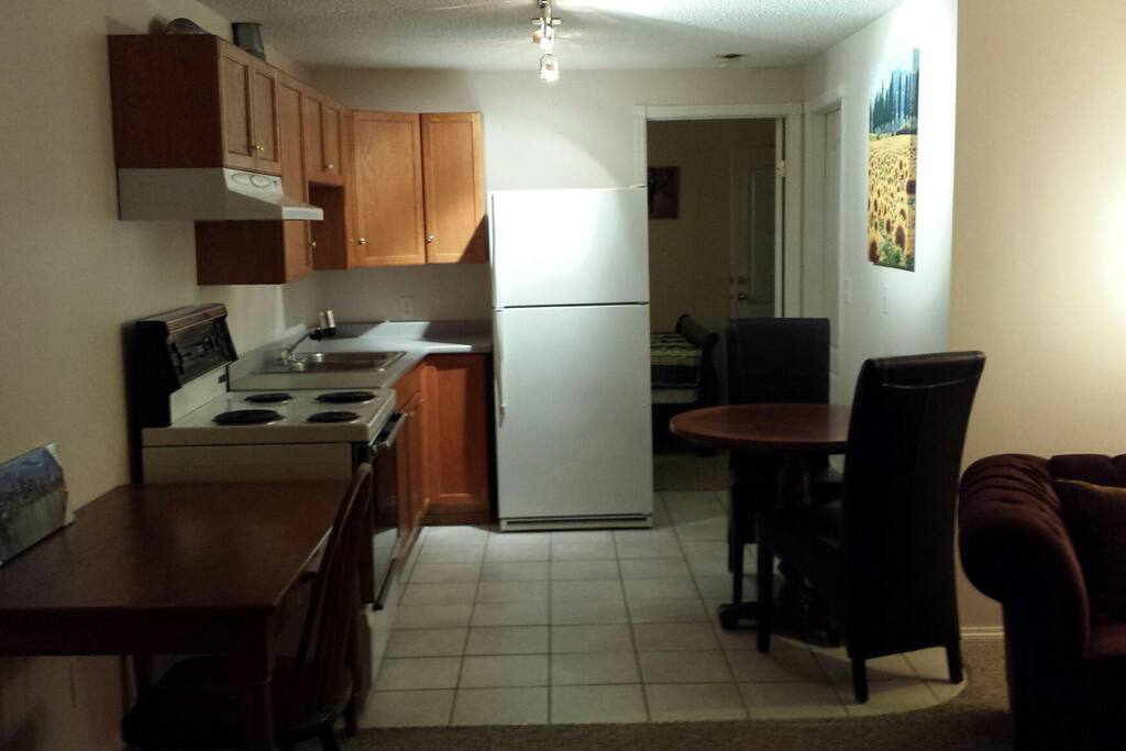 Kitchen, dining nook and computer desk.