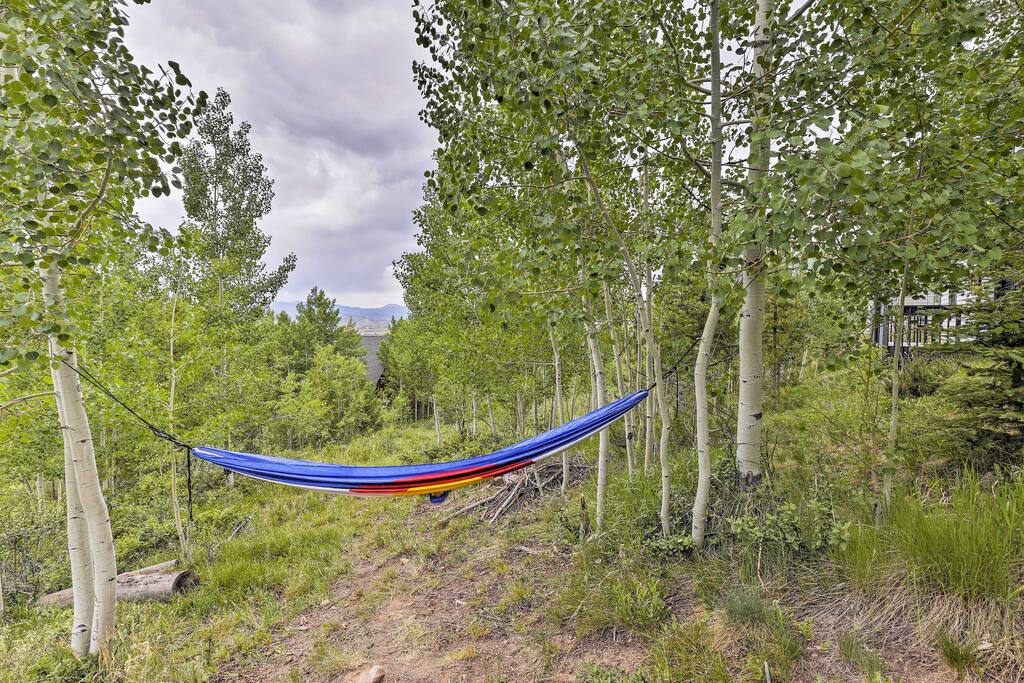 The property overlooks expansive views of the mountains, aspens, and evergreens.