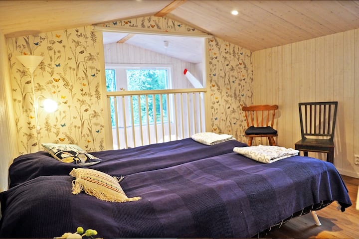 A nice bedroom in the attic with mountain views (extra bed available). 
You can look down on the kitchen / living room on the ground floor. Where there is a sofa bed for two.