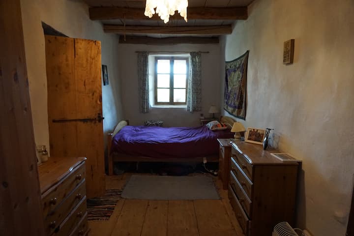 Spacious double bedroom with view to balcony and  garden