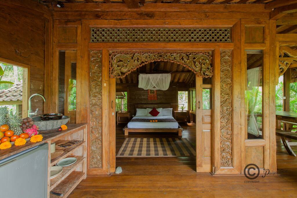 The master bedroom and small kitchen