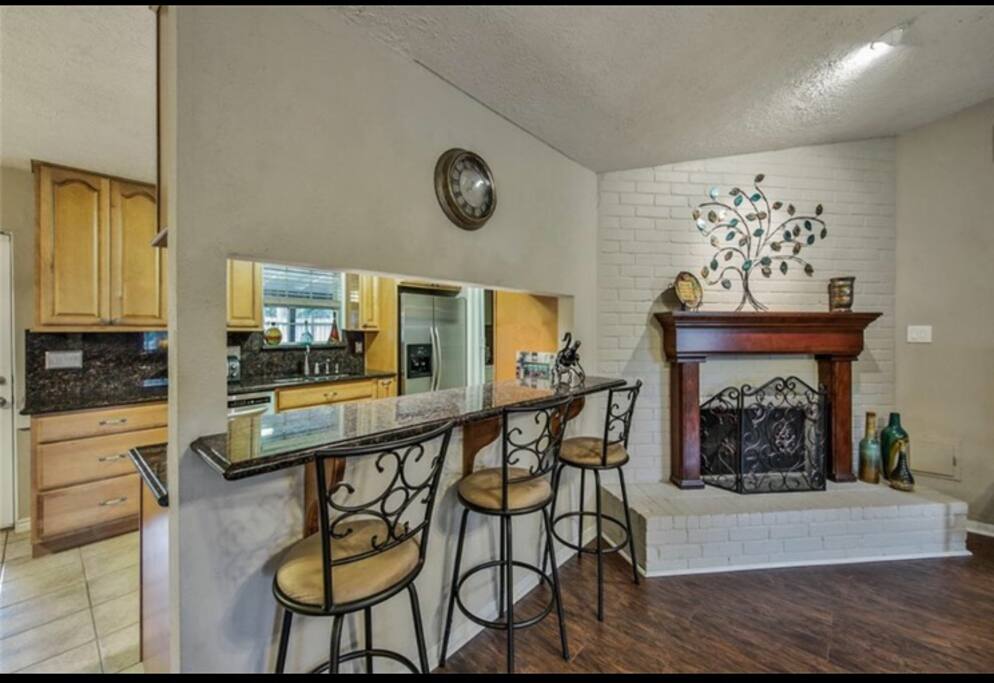 Bar seating to kitchen