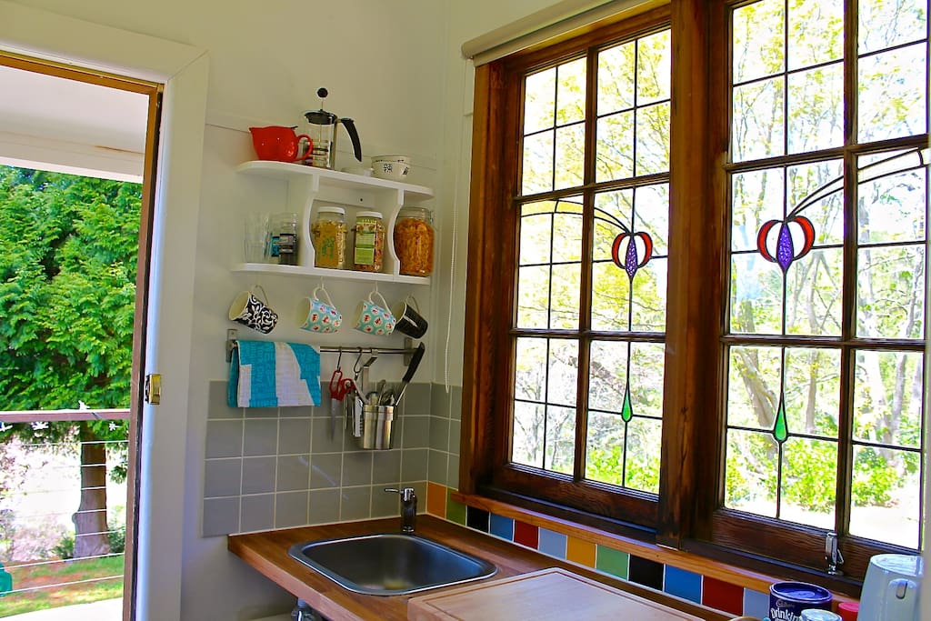 Deco inspired kitchenette that leads on to the private deck.