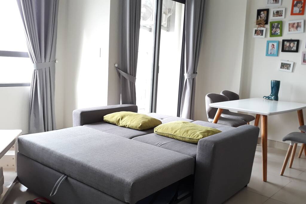 Living room with a sofa bed, 4 chairs-dinning table.