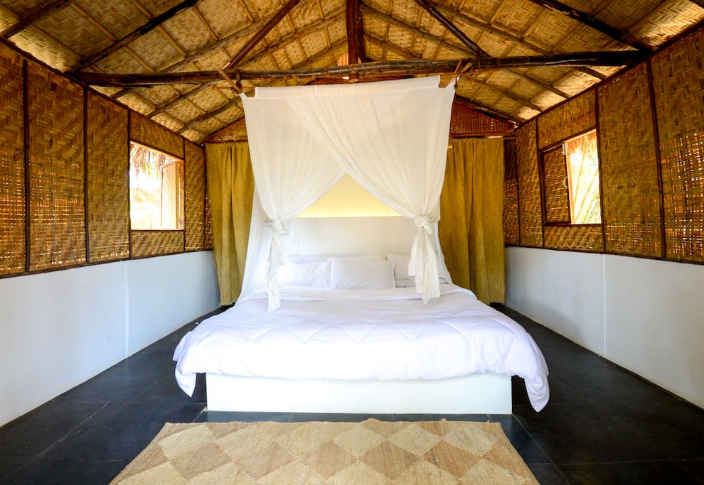 Master Bedroom -The Bedroom with High Quality Super soft Mattress and Bed Linen, Along with Mosquito Net, Jutex Hemp Rugs to ensure the most comfortable sleep