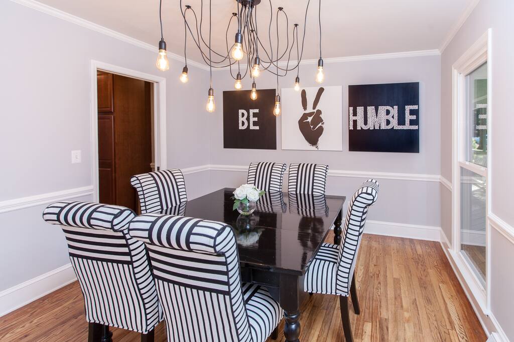 Dining Room with original art and table that can seat up to 8