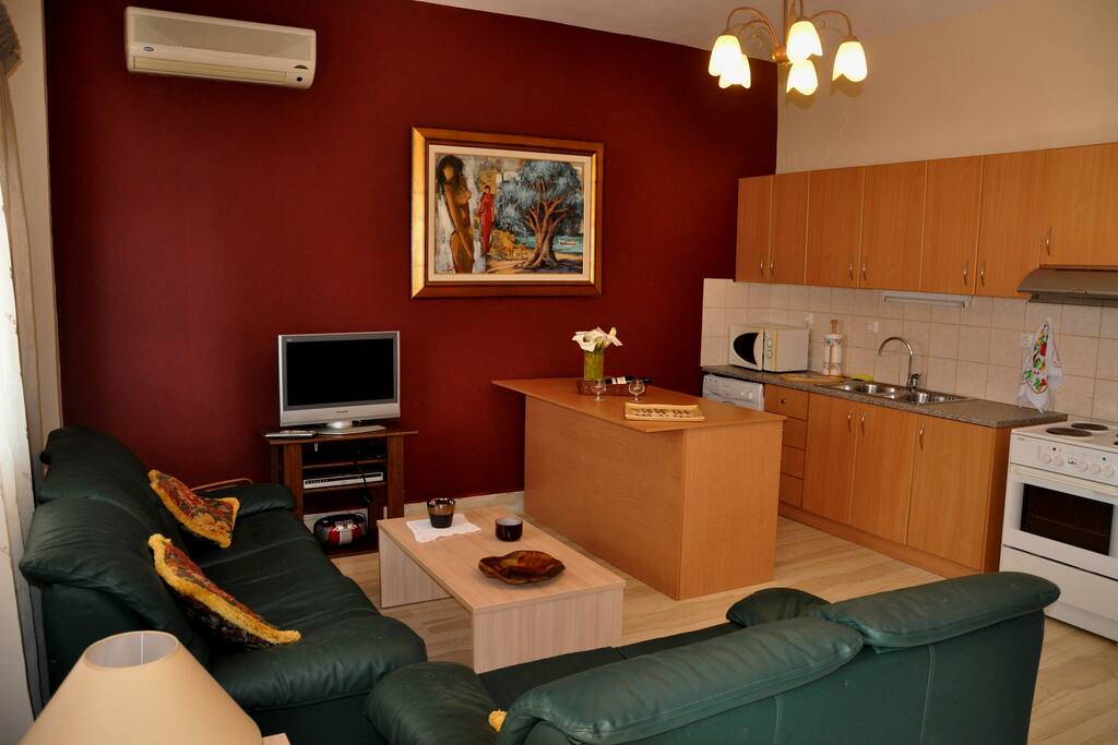 Apartment's living room and kitchen as seen from the entrance