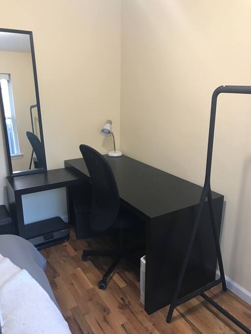 Large working space with printer access. Lots of space to hang up clothes.