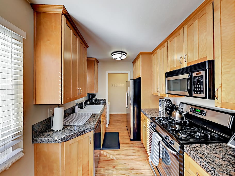 With stainless steel appliances, a large gas range, double sink, microwave, and dishwasher, making meals is a breeze.
