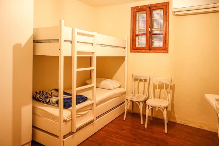 The first room has 2 beds and a pull out bed, so it can fit up to 3 people in beds