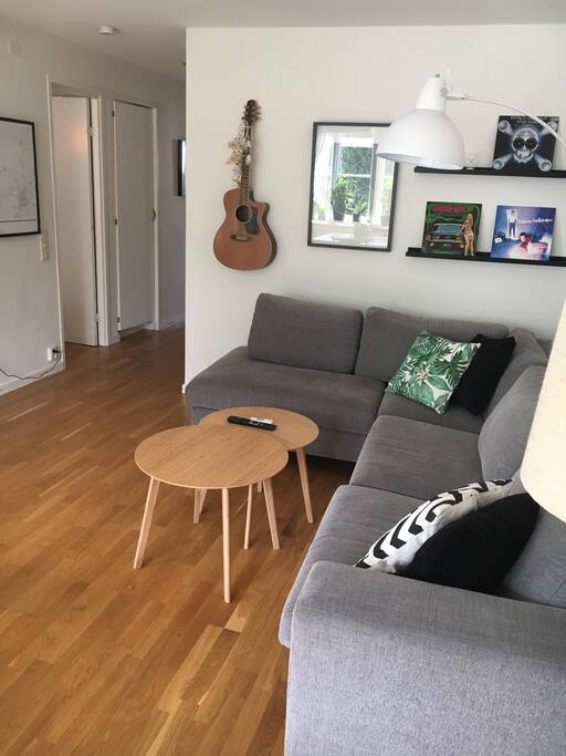 Living room with large couch and a big TV.
