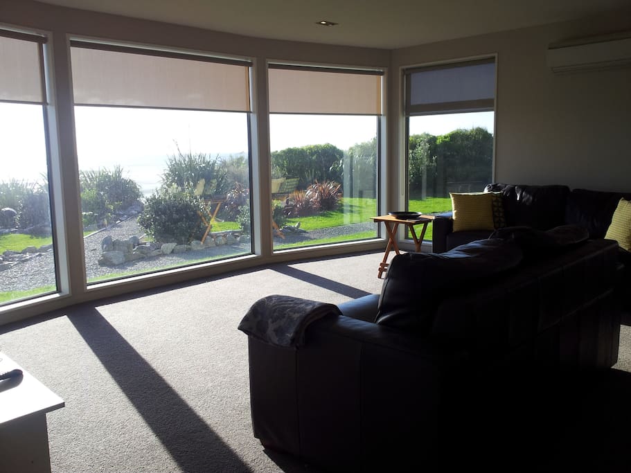 Living room view across garden to sea - excellent walking beach at end of shingle path in photo