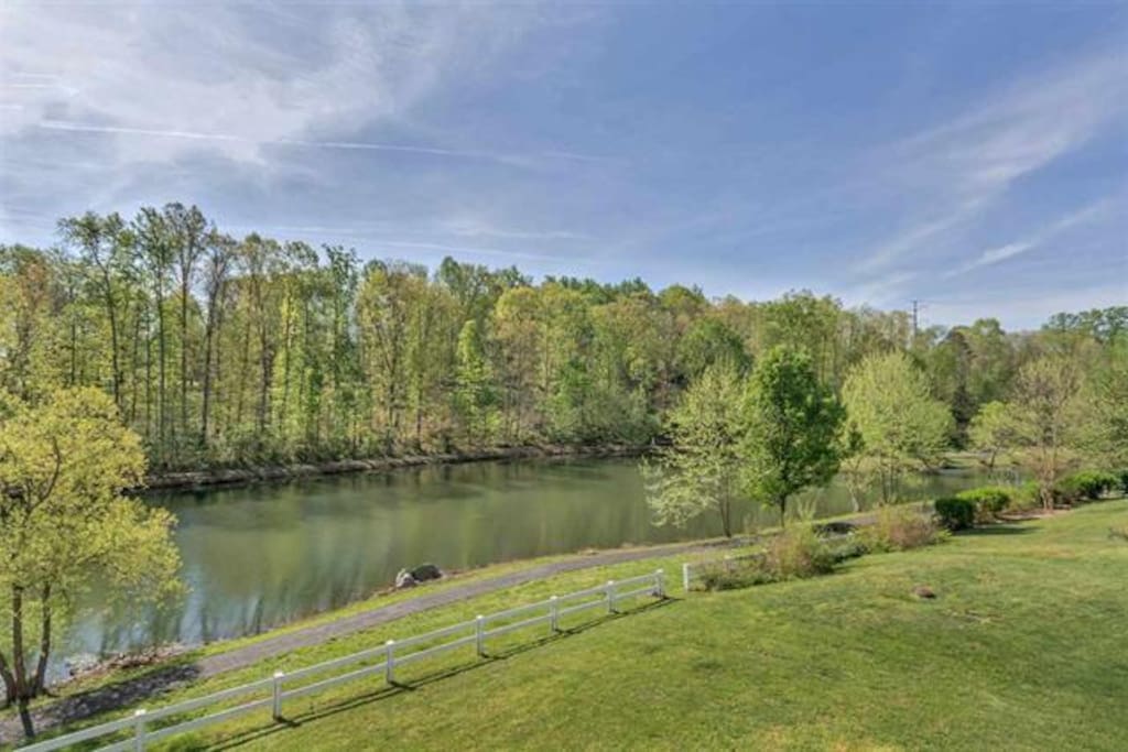 View from deck of pond and walking trail. Enjoy a cup of coffee in the morning or a cocktail to close out the evening
