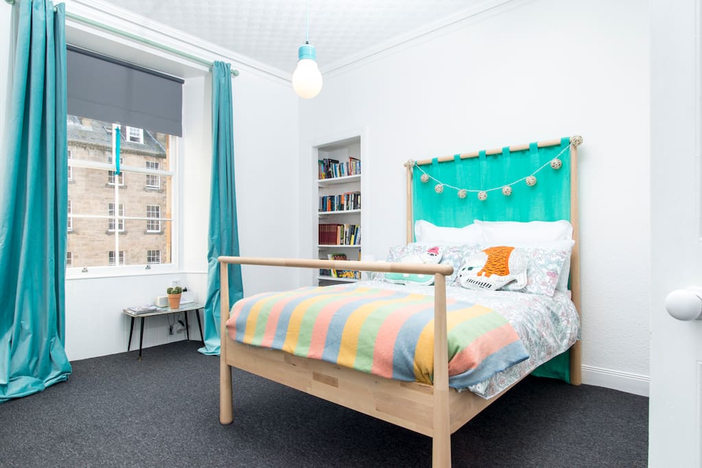 Beautiful big double bedroom with large window looking over the street. There are blackout blinds and curtains if you like a dark room to sleep in