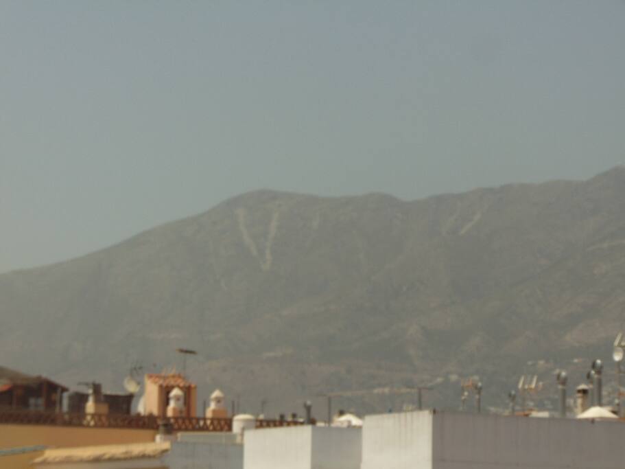 Enjoy mountain views from the rooftop terrace while you sunbathe.