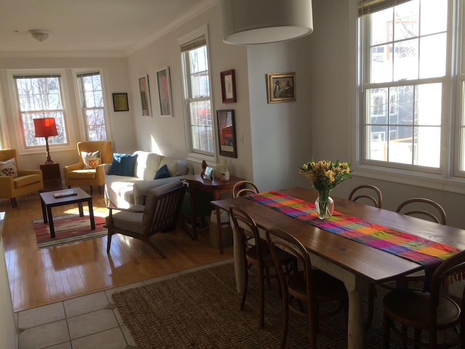 The open dining room and living room (open kitchen to the left). Second-floor views and light.