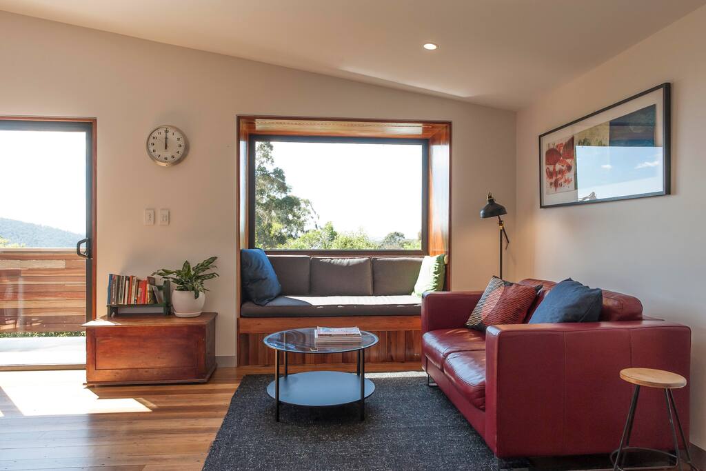 Living room with reading nook to sit and enjoy the sun and view or curl up with a book