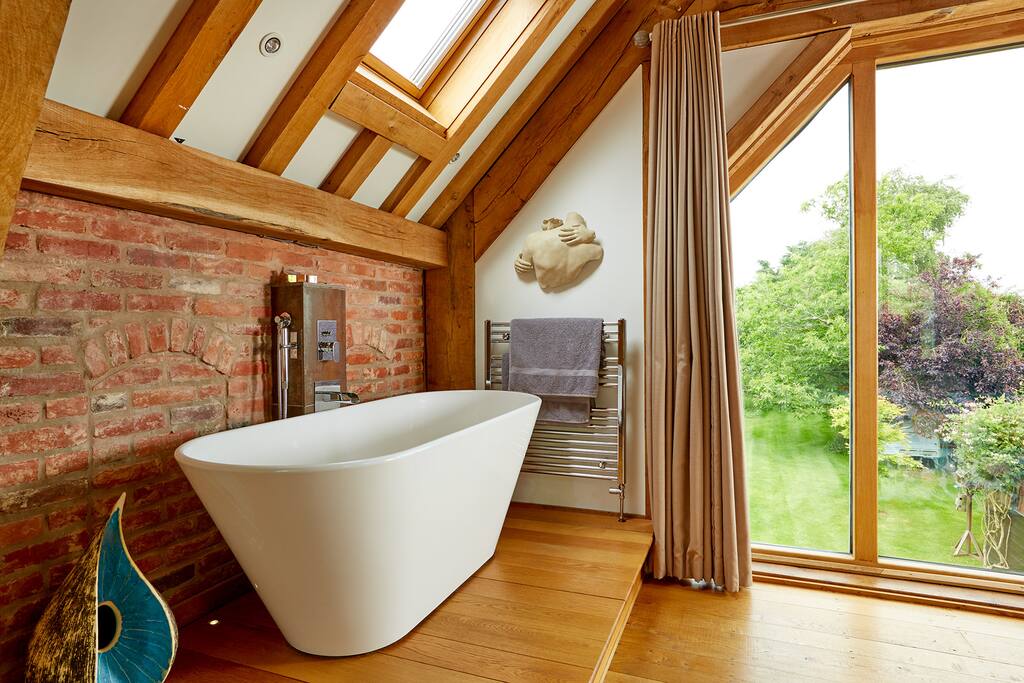 Bath on its own platform in the room