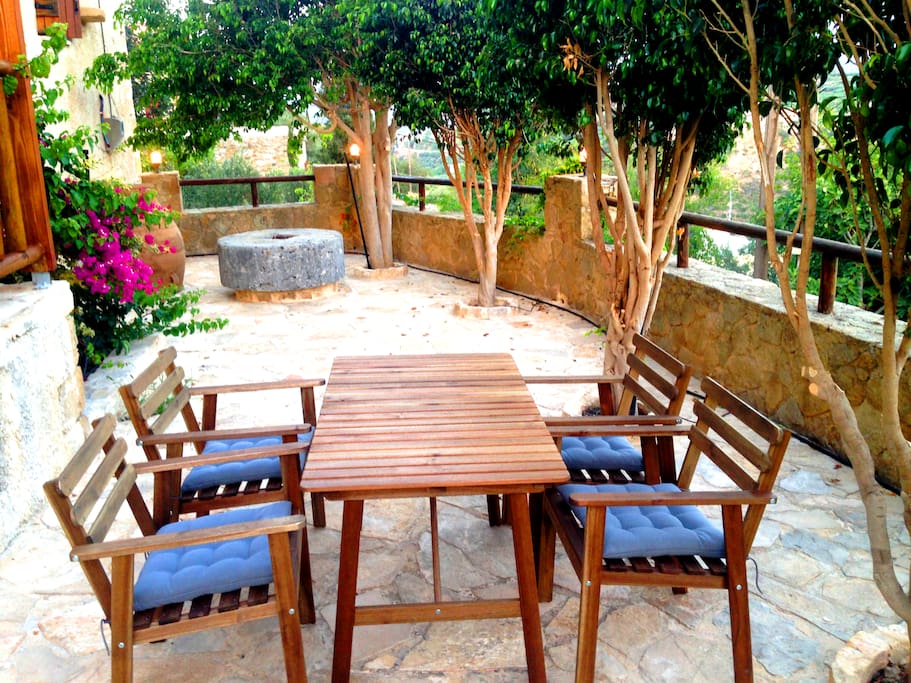 The sitting place of the front yard. If needed there are more chairs aside to enjoy meal or coffee.