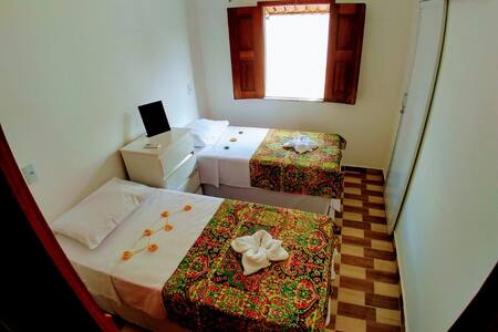 Suíte linda e confortável com AC a 300m da praia 1