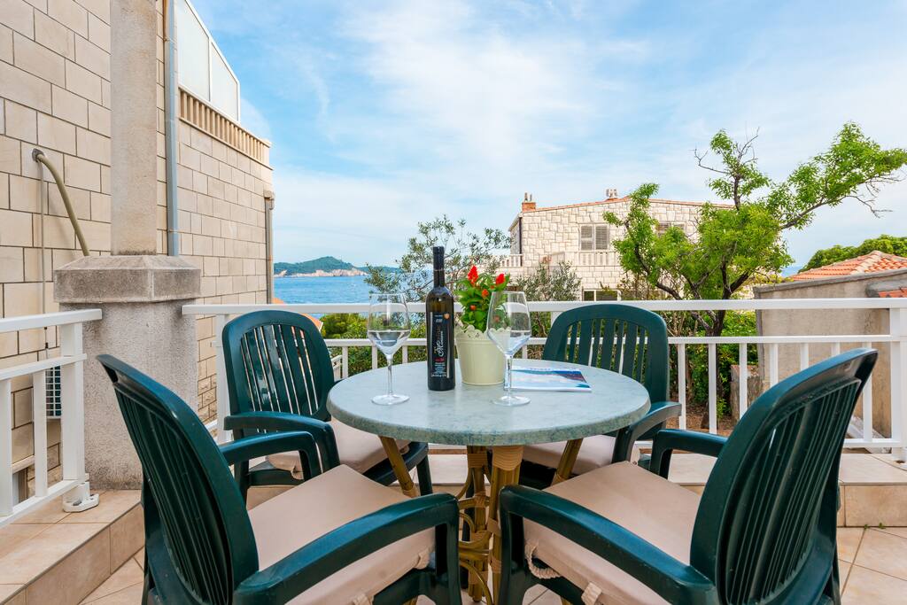 cosy terrace with sea view and outdoor seating
