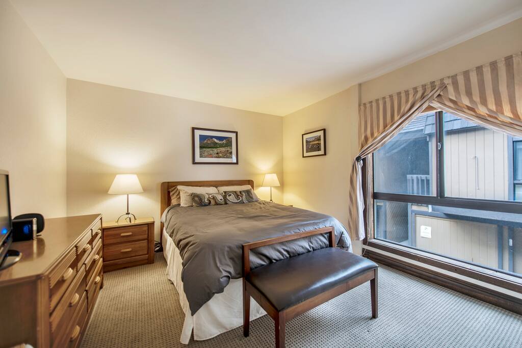 Downstairs bedroom with queen bed and plenty of room and storage