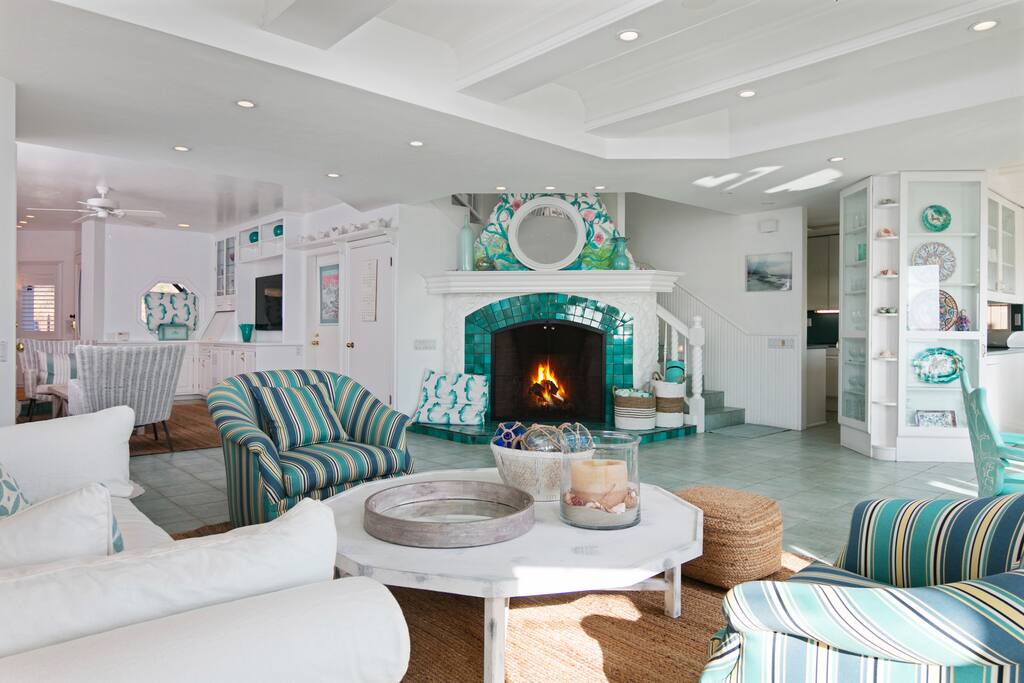 Decorative turquoise tiles surround the fireplace, which offers warmth and ambiance on cool nights.