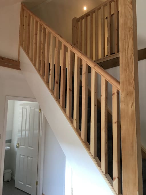 Open plan hall and stairs leading to the bedroom