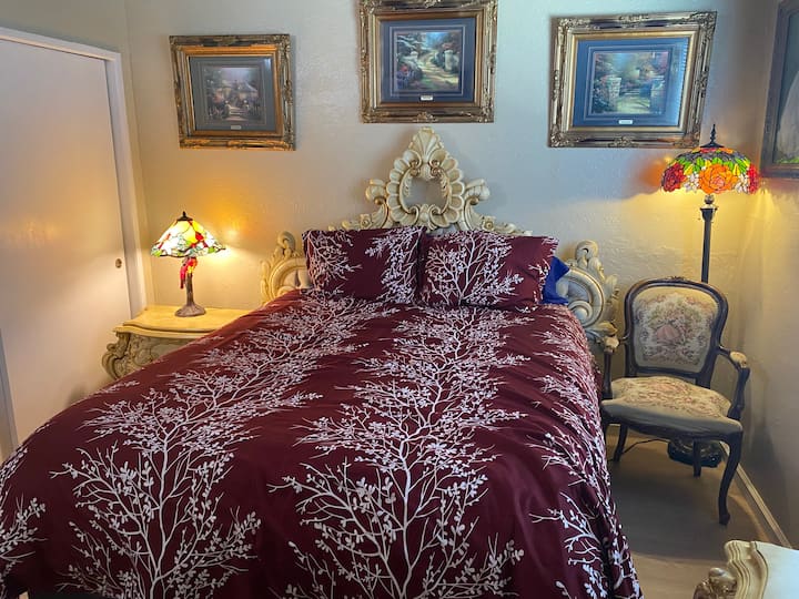 Larger Bedroom, Queen Size bed with pillow top mattress, Exotic Bedroom set, Needlepoint chair, Cardinal-Stained Glass Lamp, Tall Tiffany Stained-Glass Lamp shade, Extravagant Art!