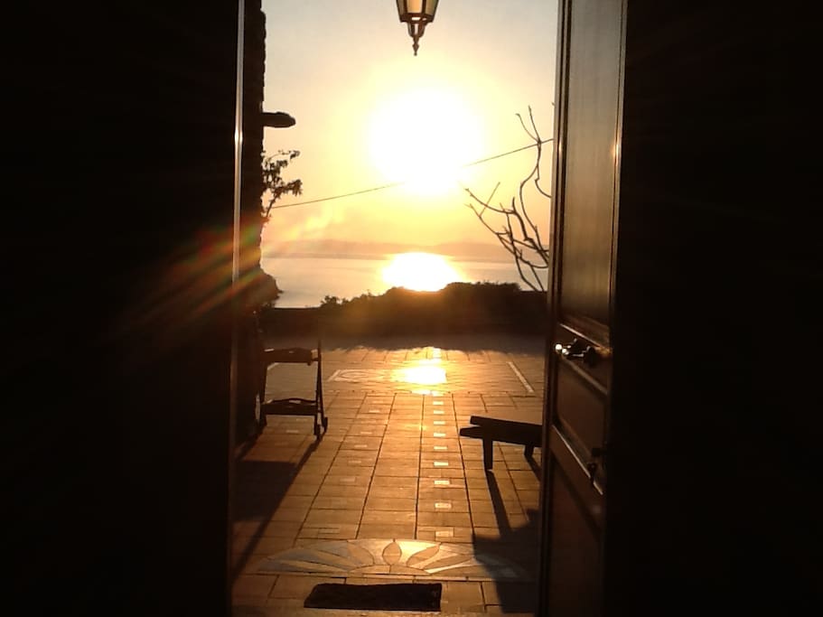 The sunset as seen from the inside of the house.