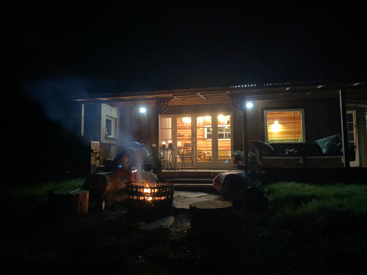 Relaxing beside the outdoor fire at Teal Corner in Okoroire