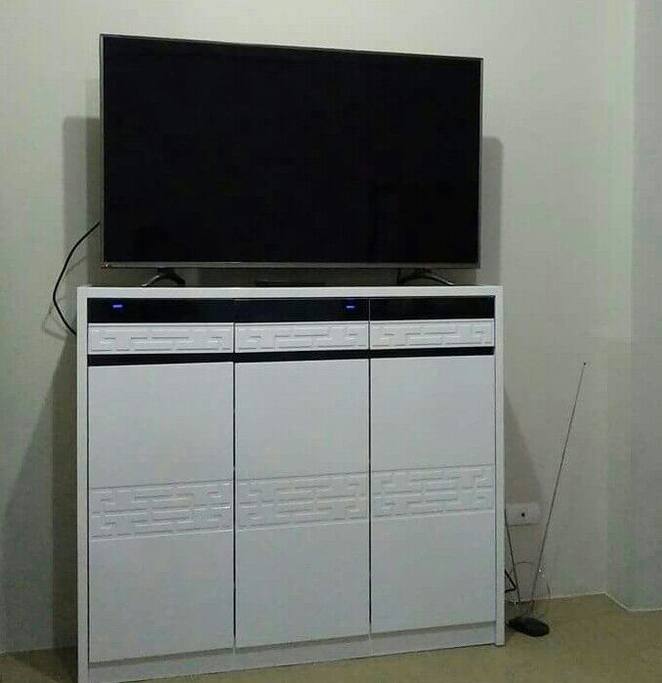50-inch. Smart TV with multi-purpose rack