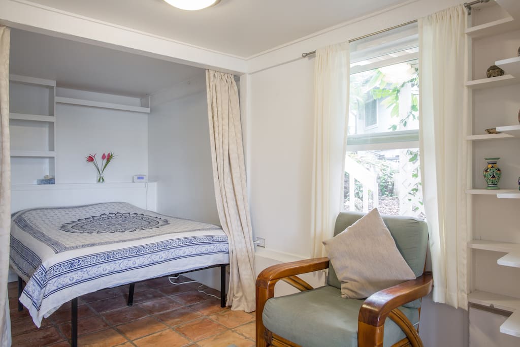Queen sized bed and chair.
