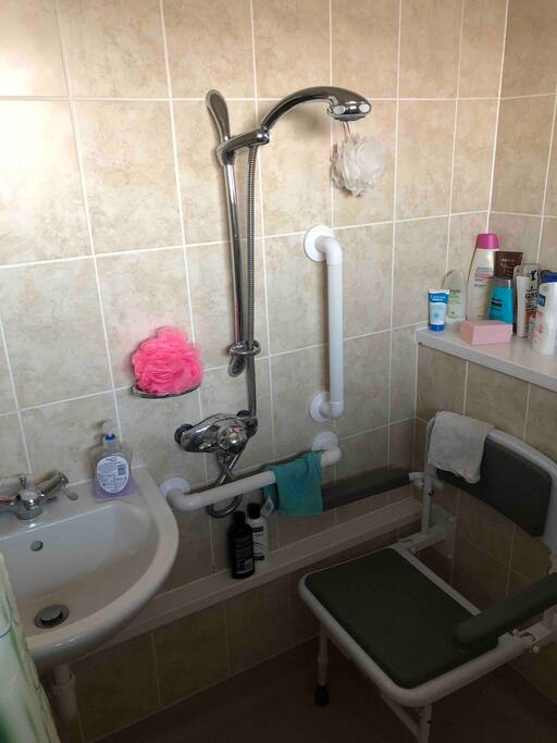 This is a picture of my new bathroom with a seat for sitting down if you have disability issues
